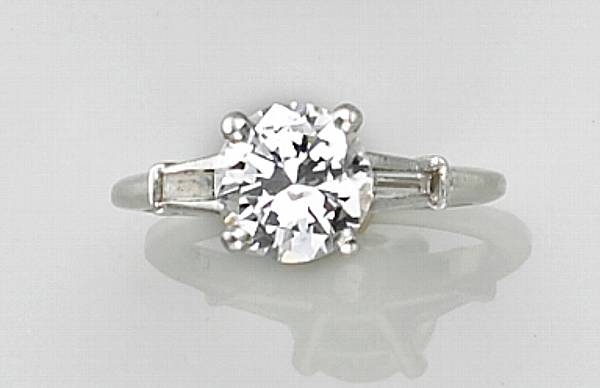 A diamond and platinum ring principal diamond weighing approximately 1
