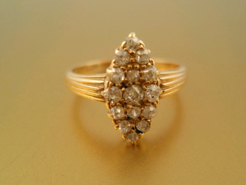 A Victorian diamond cluster ring marquis shaped head set with