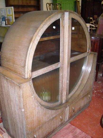 A limed oak dining suite in the Art Deco taste