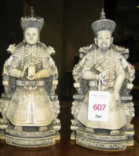 PAIR OF ANCESTRIAL ASIAN CARVINGS Showing a seated man and
