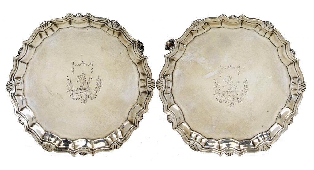 A PAIR OF GEORGE II WAITERS the moulded rim with