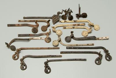 Nineteen iron shutter stays hand wrought arms cast terminals varying