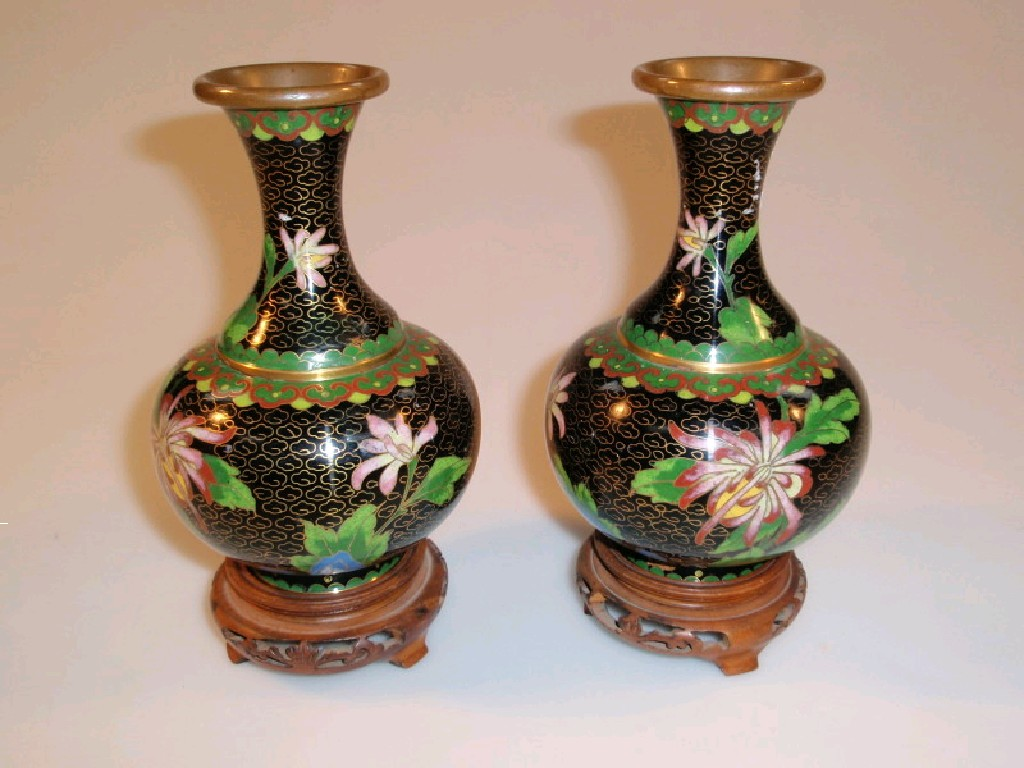 A pair of 20thC Chinese cloisonn baluster vases enamelled with