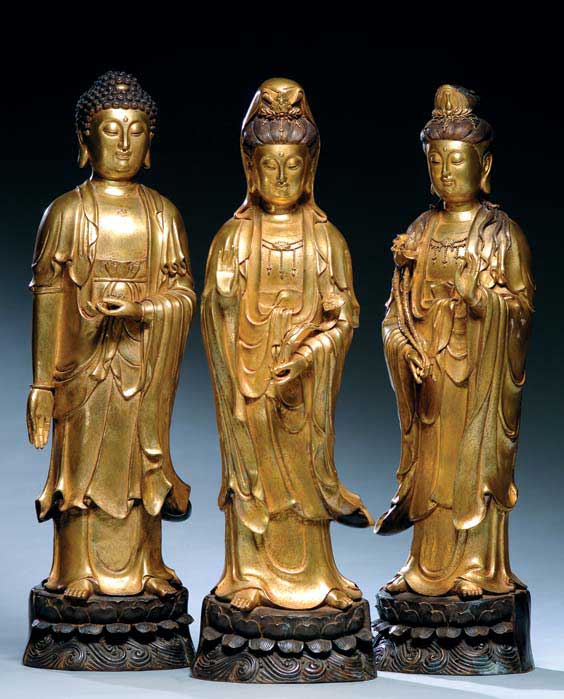 THREE GILT BRONZE FIGURES Group of three Chinese gilt bronze