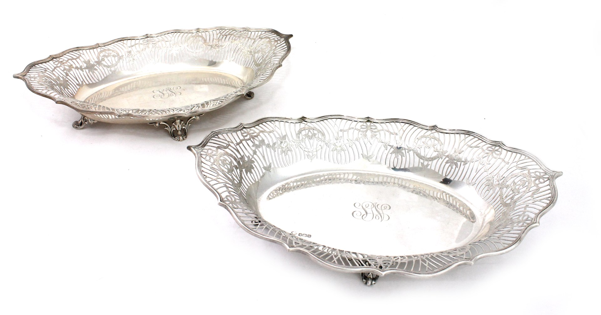 Two similar silver shaped oval baskets each with pierced and