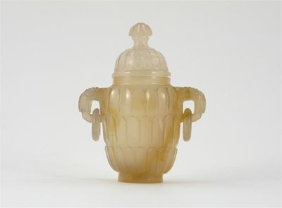 A small agate ovoid vase and cover finely carved with