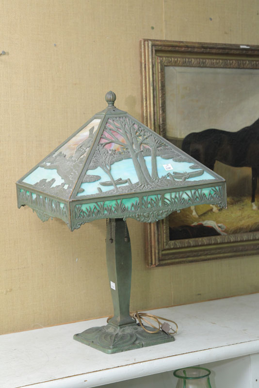 TABLE LAMP Foliate cast brass base having a polychrome slag