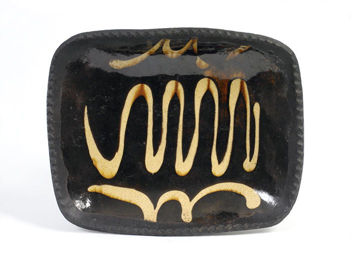 FINE ENGLISH GLAZED AND SLIP DECORATED REDWARE OBLONG CHARGER PROBABLY