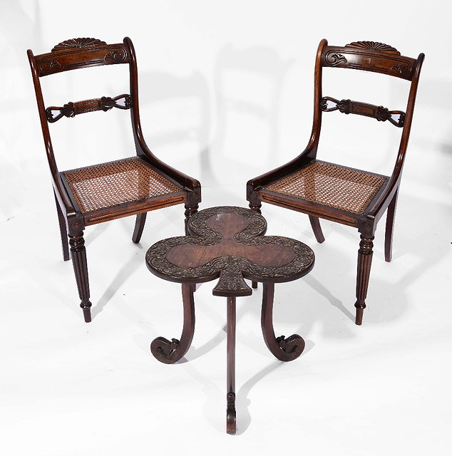 A CARVED WOOD CLOVER LEAF OCCASIONAL TABLE with scrolling foliate