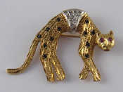 A 9 carat gold brooch designed as a cat and