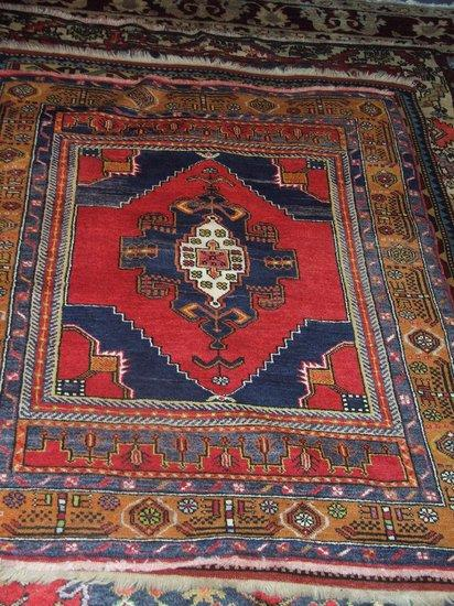 A TURKISH ADANA RUG woven with pendant medallion within a