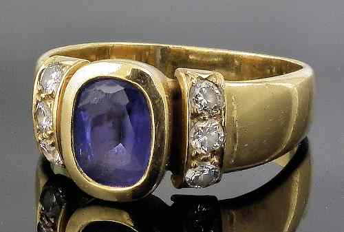 A modern 18ct gold mounted tanzanite and diamond set dress
