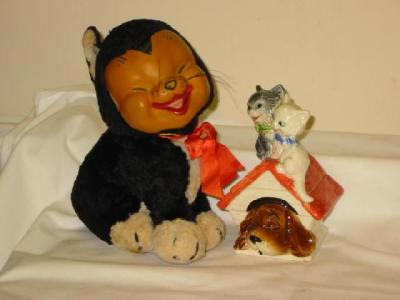 A Merrythought seated cat soft toy with moulded rubber Happy