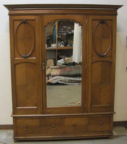 LATE VICTORIAN OAK WARDROBE English c 1900 centering a single