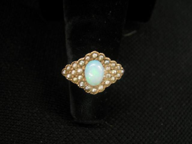 Opal Ring fiery blue green oval gem surrounded by seed