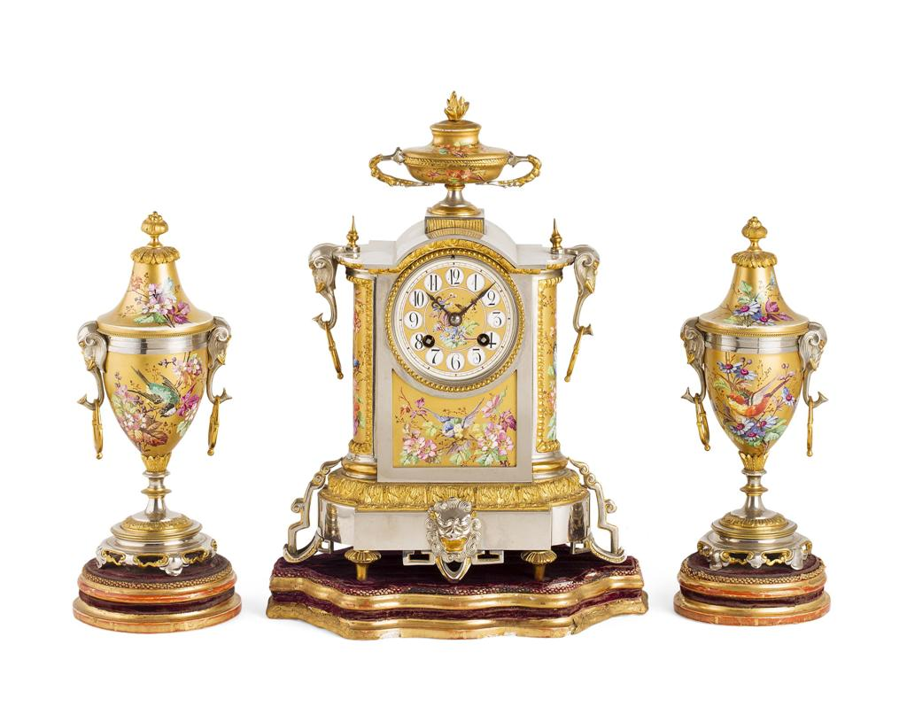 FRENCH GILT AND SILVERED METAL THREE PIECE CLOCK GARNITURE 19TH