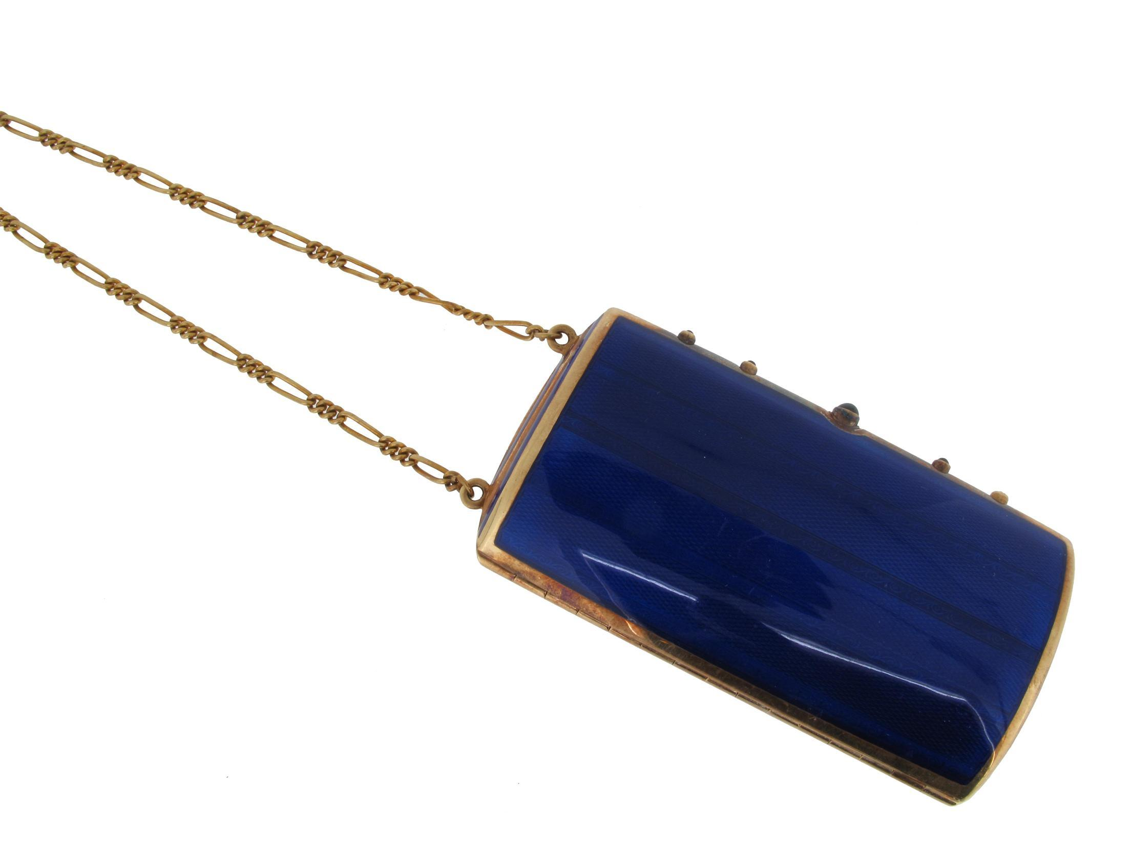 A gold minaudi 232 re with blue enamel decoration