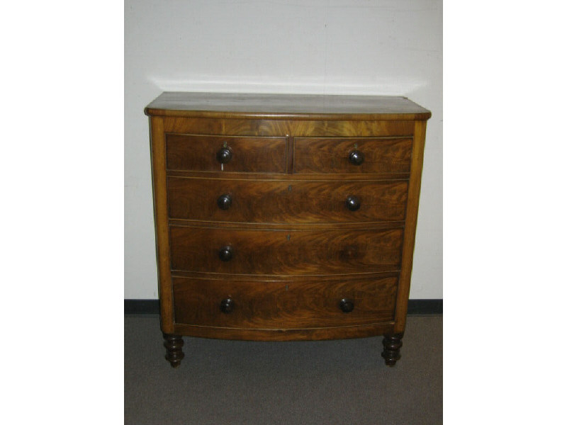 ENGLISH VICTORIAN FLAME FIGURED MAHOGANY CHEST The bowed front with