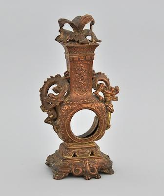 A Bronze Pocket Watch Holder In the shape of a