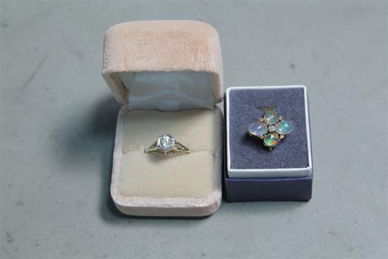TWO LADIES RINGS One tested 14K yellow gold with four