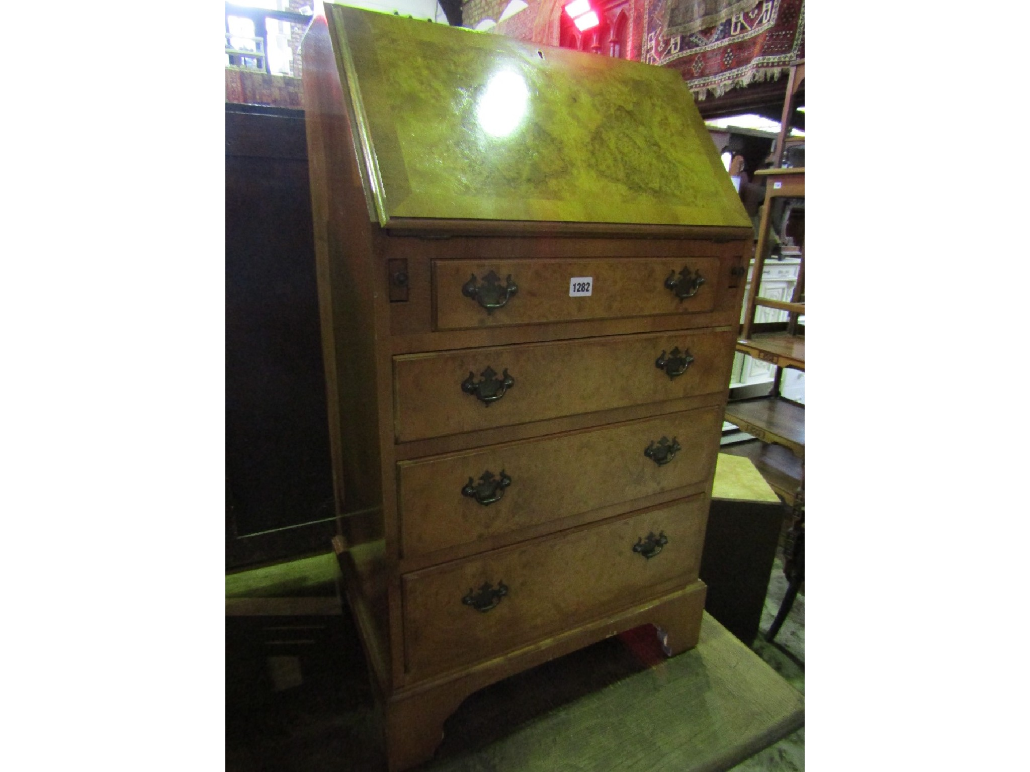 A reproduction Georgian style walnut veneered ladies writing bureau with