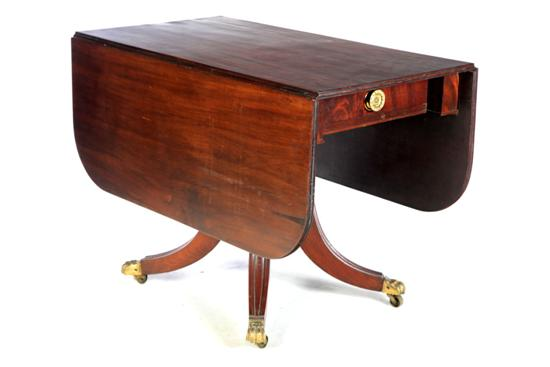 REGENCY DINING TABLE England early 19th century mahogany figured veneer