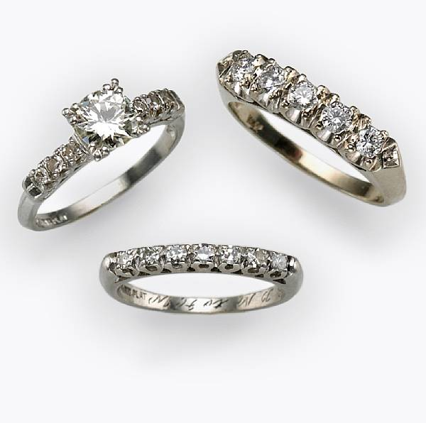 A diamond wedding set together with an additional 5 stone