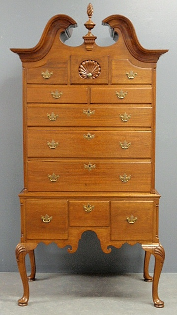 Bonnet top walnut two piece highboy with upper shell carved
