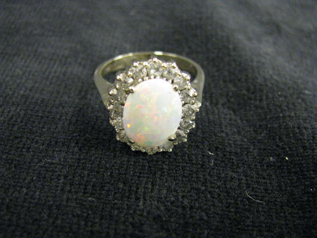 Diamond Opal Ring fiery 11x9 mm opal surrounded by diamonds