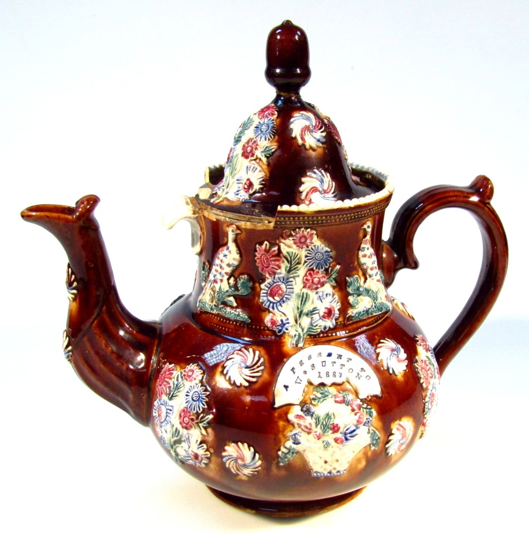 Late 19thC bargeware teapot a present to W Sutton of