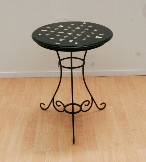 A black marble table inlaid with marble and semi precious