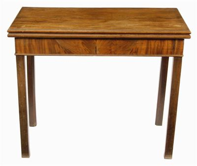 A George III mahogany card table with a hinged moulded