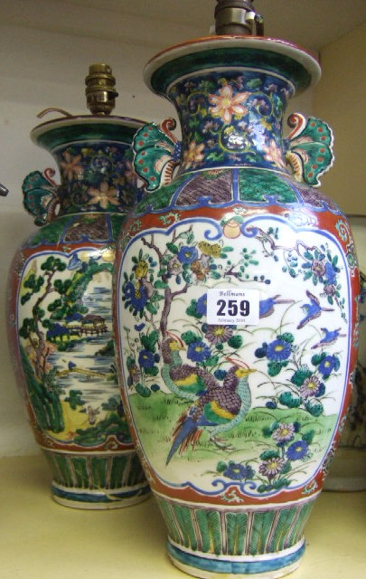 A pair of Imari style earthenware vases mounted as lamps
