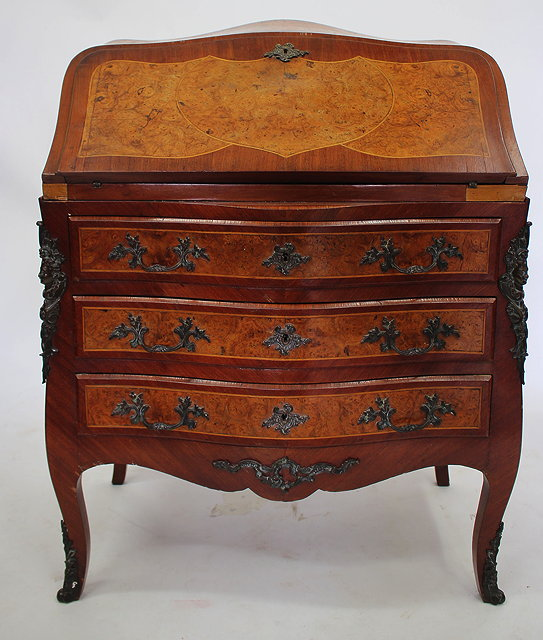 A 18TH CENTURY FRENCH STYLE WALNUT BUREAU with serpentine top