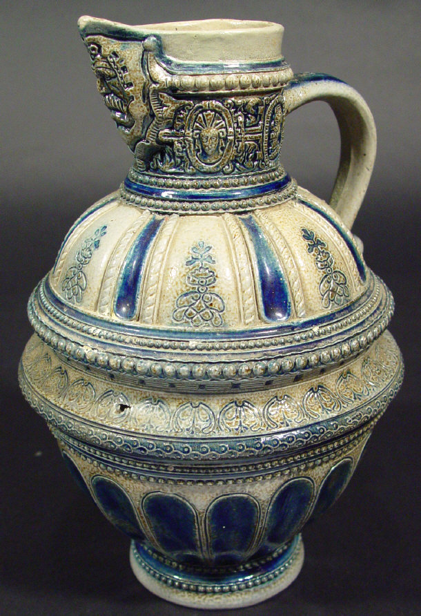 German stoneware jug moulded with a mask to the spout