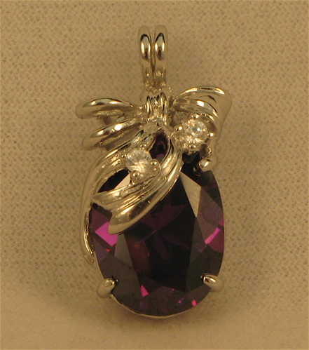 AMETHYST DIAMOND AND FOURTEEN KARAT WHITE GOLD PENDANT set with