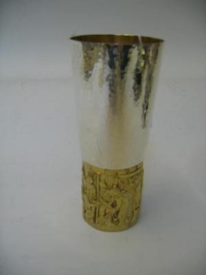 A COMMEMORATIVE BEAKER London 1972 with beaten tapered sides gilded