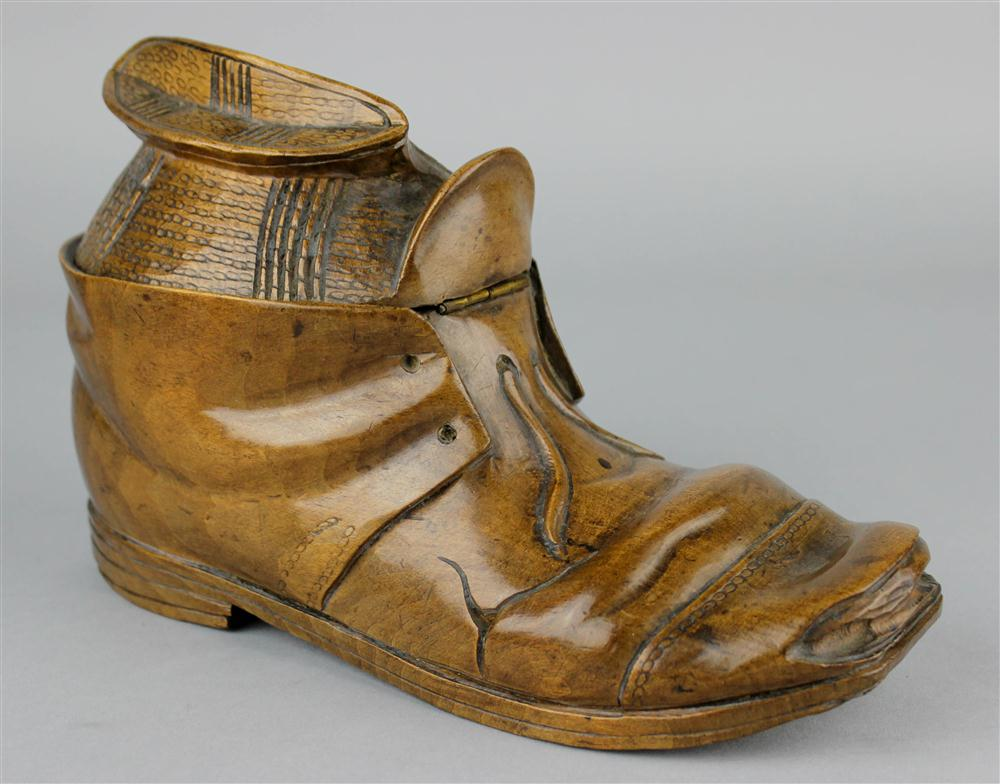 A NATURALISTICALLY CARVED WOOD SHOE FORM BOX carved as a