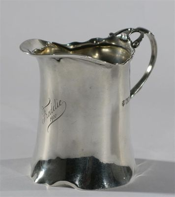 A silver jug by George Jackson and David Fullerton cylindrical