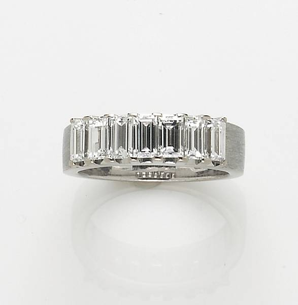 An emerald cut diamond and 14k white gold ring estimated
