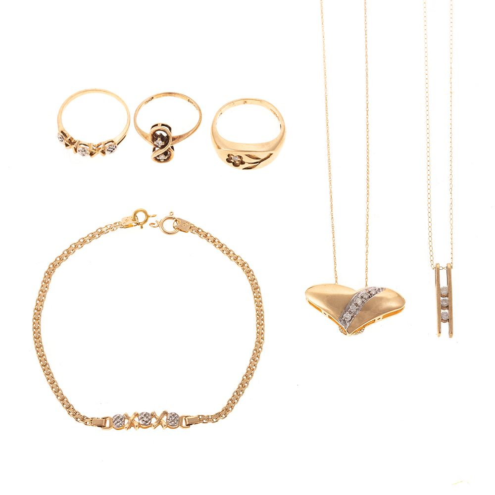 An Assortment of Jewelry with Diamonds in Gold 1 14K