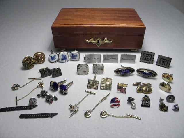 Box lot of assorted men s tie clips cuff links