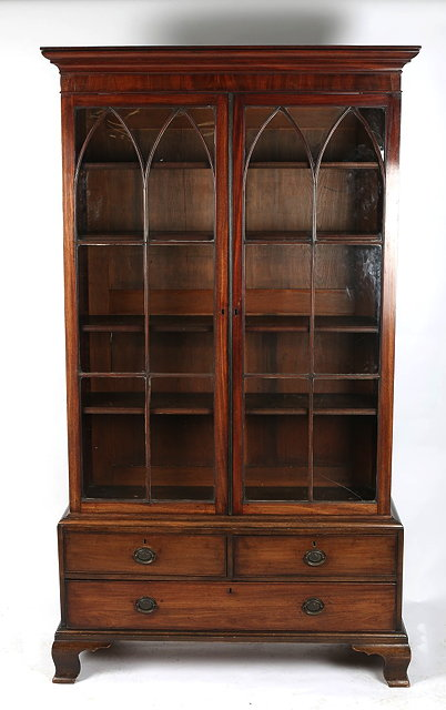 A 19TH CENTURY MAHOGANY BOOKCASE CONSTRUCTED IN TWO SECTIONS the