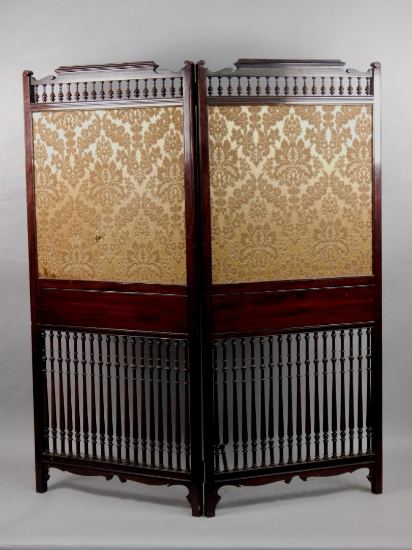 An Edwardian mahogany two fold screen inset with a gold