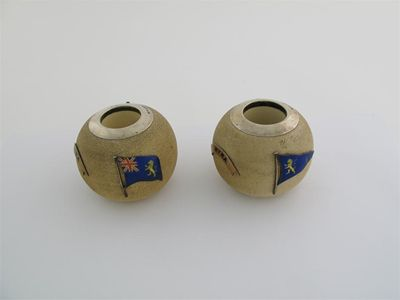 A pair of late Victorian mounted pottery vesta globes each