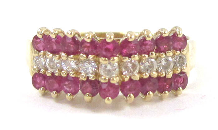 RUBY DIAMOND AND FOURTEEN KARAT GOLD RING set with two