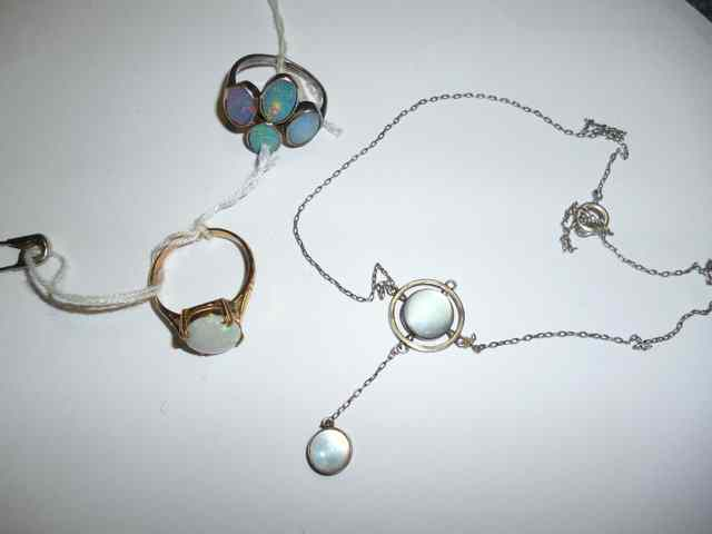 A 9CT GOLD OPAL SET RING together with a white