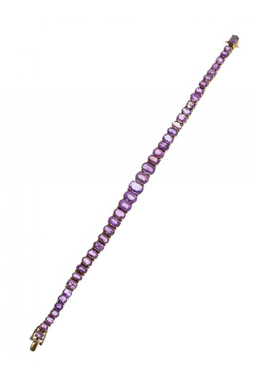 A PINK TOURMALINE LINE BRACELET mounted in gold