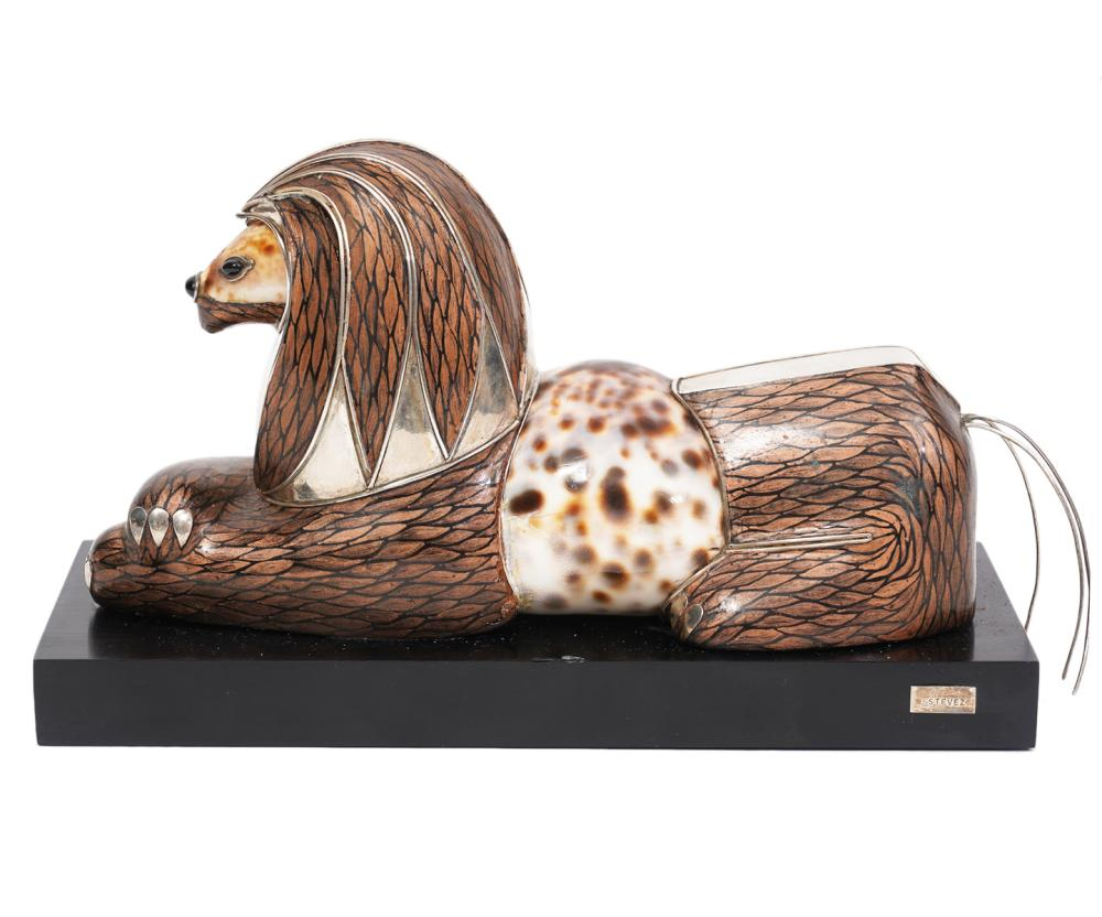 ROBERTO ESTEVEZ LION SCULPTURELion or Griffin sculpture with Cowry shell