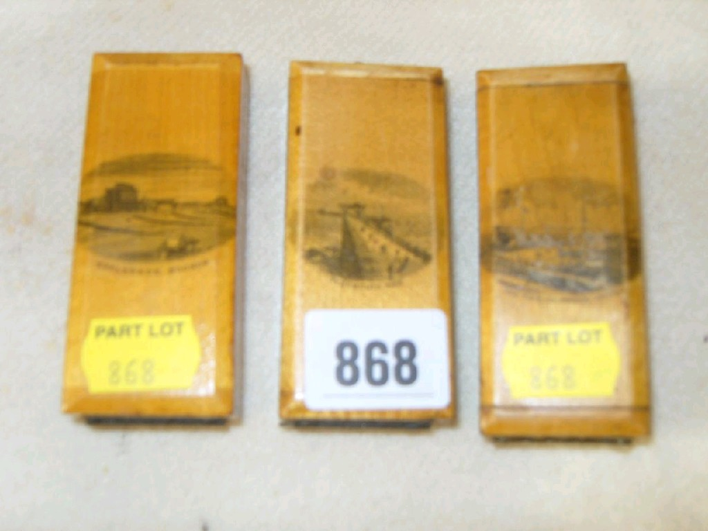 A collection of three Mauchline ware wall mounted egg timers